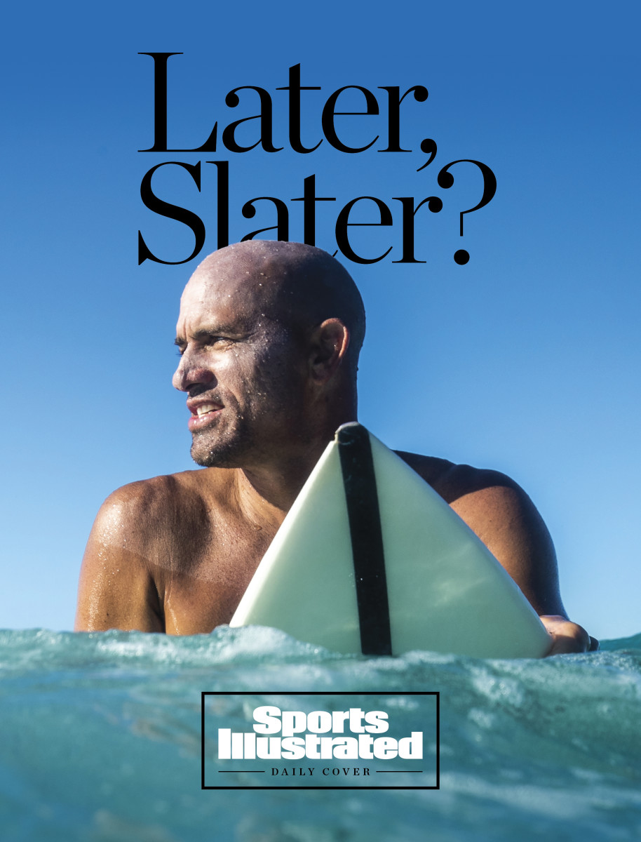 Slater on his surfboard, in the water.